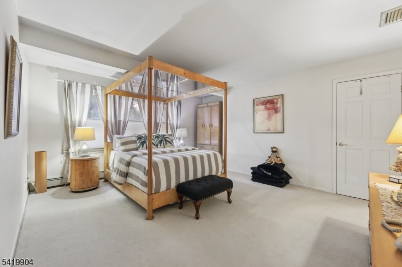 7 Valen Court Franklin Lakes, NJ 07417 - Photo 20 of 32 a bedroom with a bed and a couch