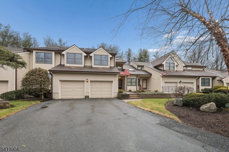 7 Valen Court Franklin Lakes, NJ 07417 - Photo 2 of 32 a front view of a house with a yard and garage