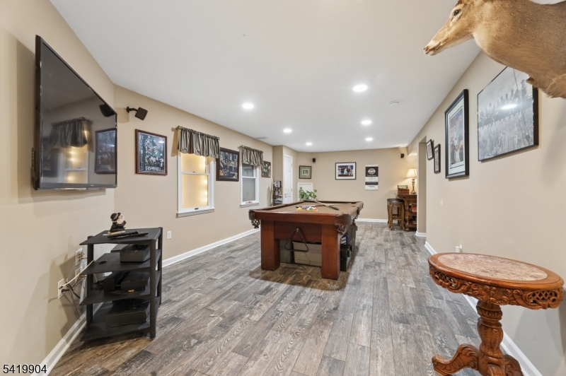 7 Valen Court Franklin Lakes, NJ 07417 - Photo 26 of 32 a living room with furniture and a wooden floor