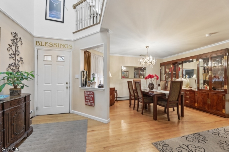7 Valen Court Franklin Lakes, NJ 07417 - Photo 3 of 32 a view of a dining room with furniture and chandelier