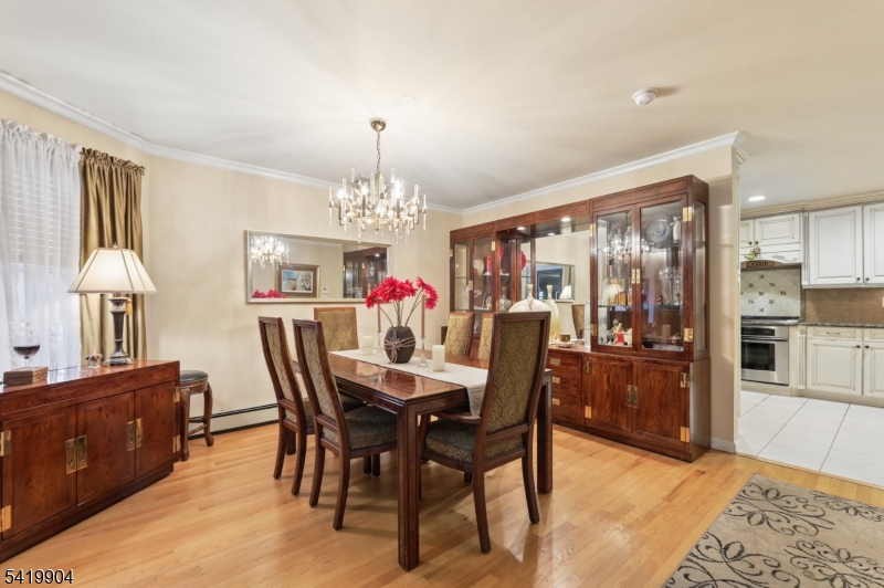 7 Valen Court Franklin Lakes, NJ 07417 - Photo 7 of 32 a view of a dining room with furniture and chandelier