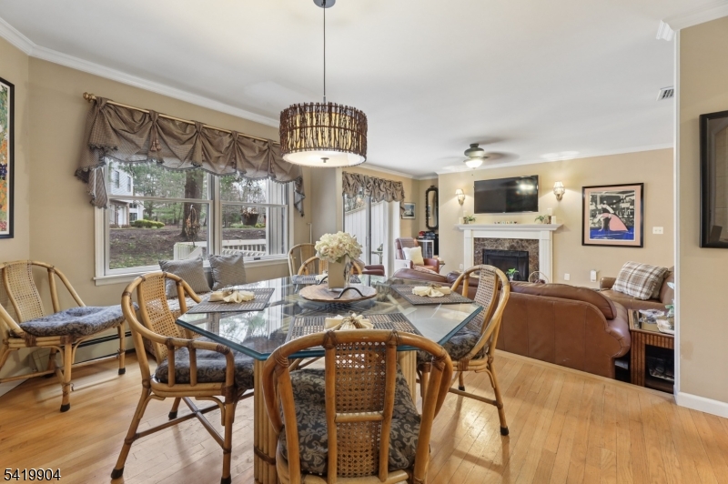 7 Valen Court Franklin Lakes, NJ 07417 - Photo 8 of 32 a view of a dining room with furniture wooden floor and chandelier