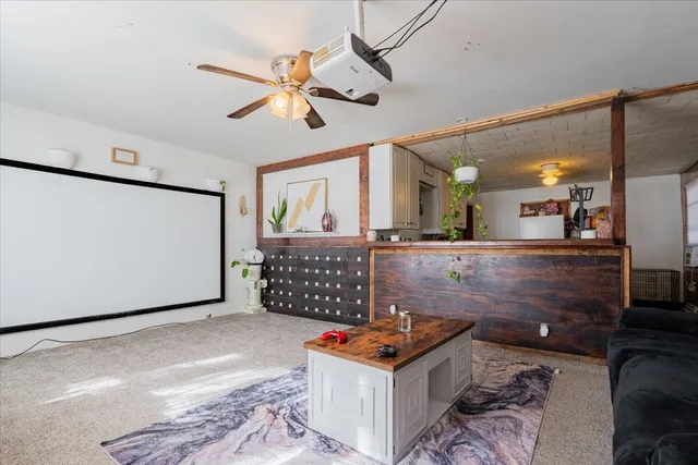a living room with a table and chairs