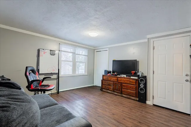 a living room with furniture and flat screen tv