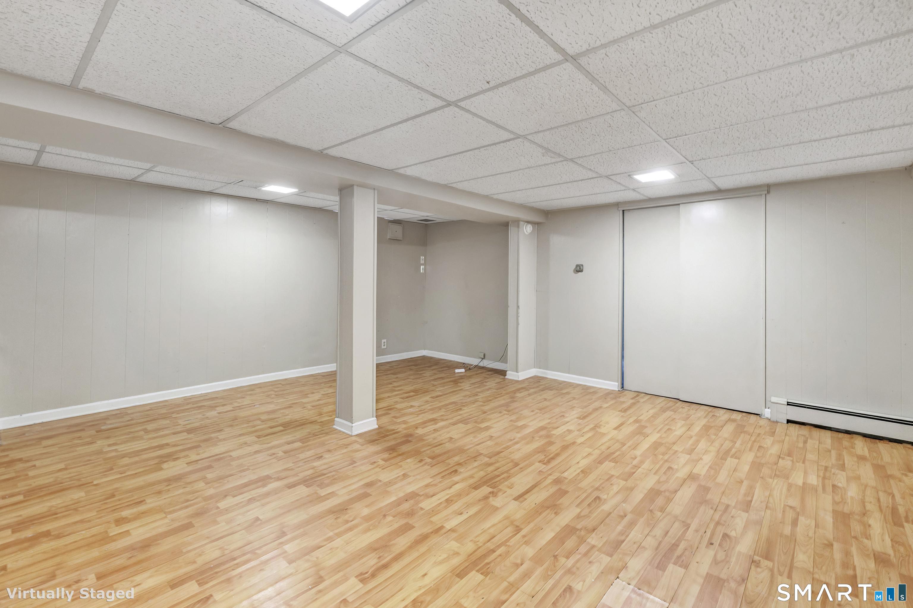 175 Post Oak Road Stratford, CT 06614 - Photo 22 of 33 PLAY ROOM AND ACCESS TO UTILITY AREA