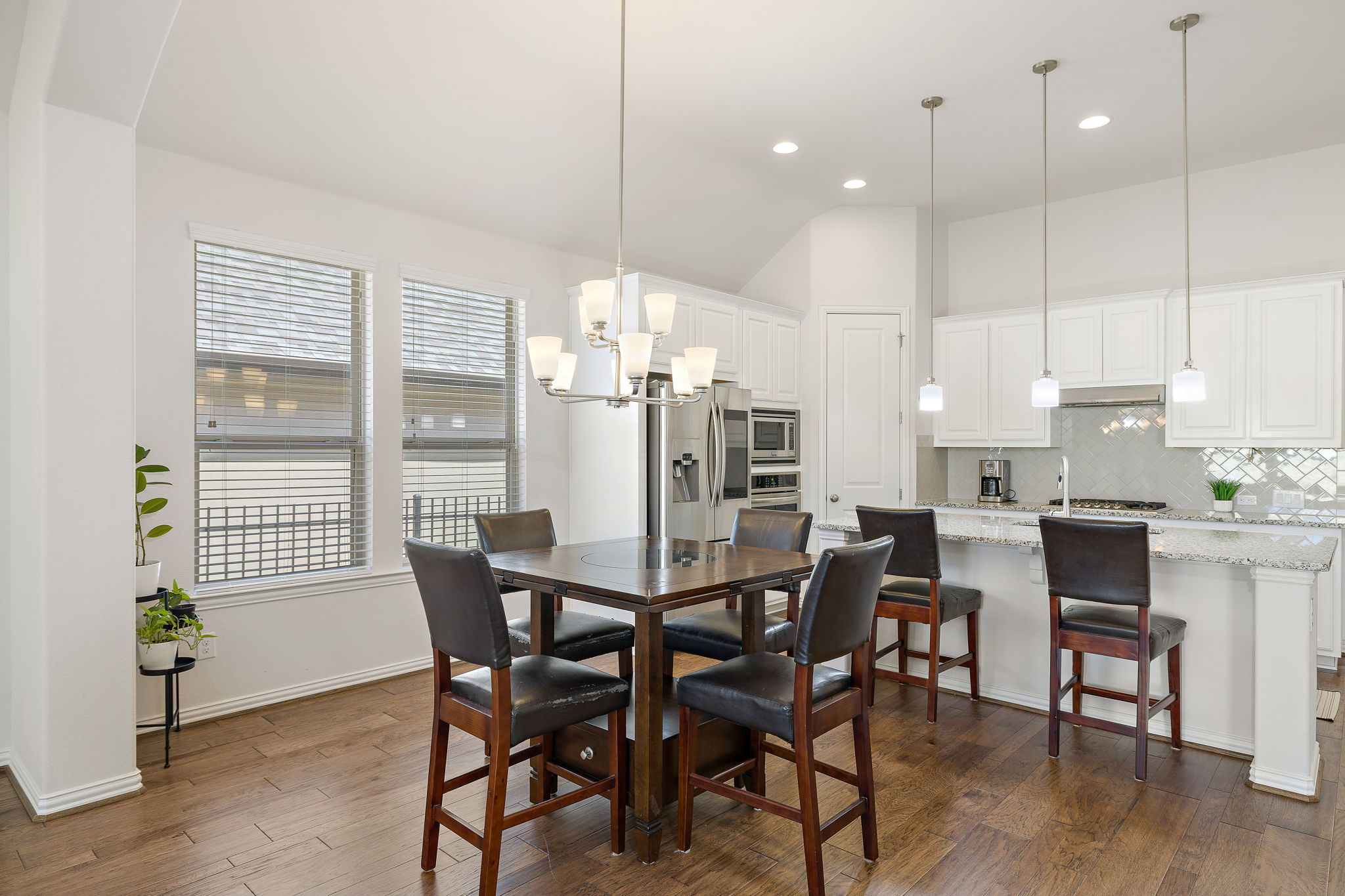 4201 Vespa Cove Leander, TX 78641 - Photo 7 of 29 a view of a dining room with furniture window and wooden floor
