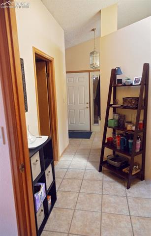 20 Sommerlyn Road Colorado Springs, CO 80906 - Photo 8 of 50 20 Sommerlyn Rd: Hallway to Entry (from Bedroom #2)