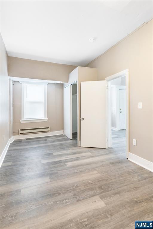52 South State Street Hackensack, NJ 07601 - Photo 2 of 14 a view of empty room with wooden floor and fan