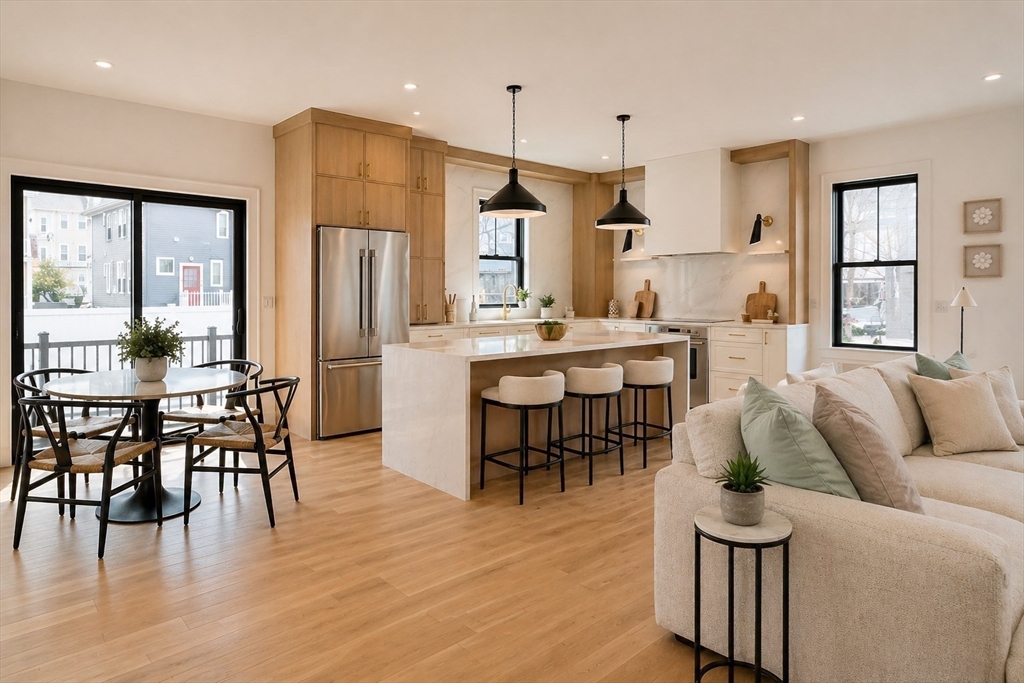 17 South Waverly Street, Unit 17 Boston, MA 02135 - Photo 1 of 29 a living room with furniture dining table and wooden floor