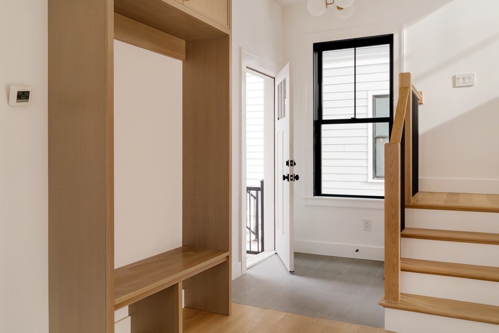 17 South Waverly Street, Unit 17 Boston, MA 02135 - Photo 14 of 29 a view of an entryway with wooden floor