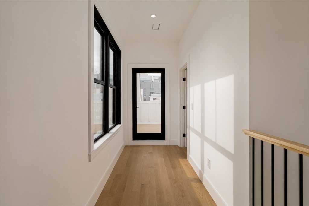 17 South Waverly Street, Unit 17 Boston, MA 02135 - Photo 22 of 29 a view of a hallway with wooden floor and entryway