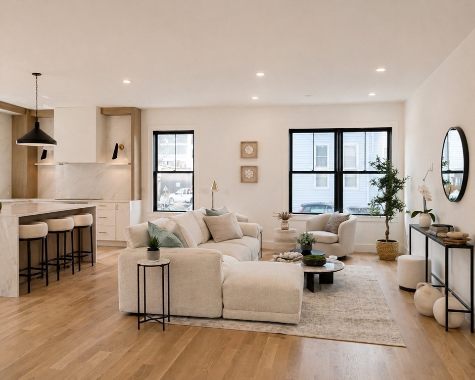 17 South Waverly Street, Unit 17 Boston, MA 02135 - Photo 10 of 29 a living room with furniture and a wooden floor
