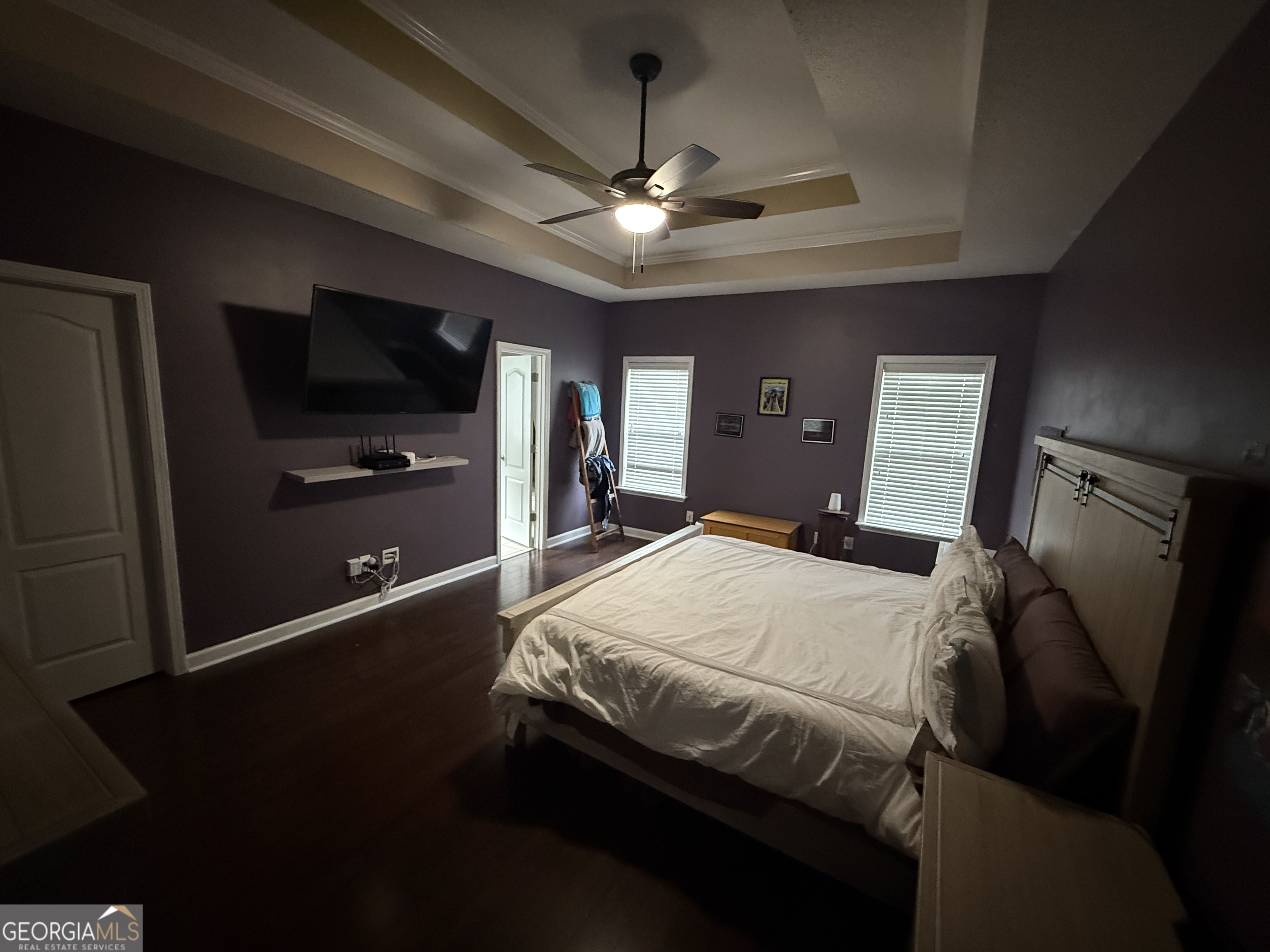 101 Hampstead Court Warner Robins, GA 31088 - Photo 12 of 18 a bedroom with a bed and a flat tv screen on wall