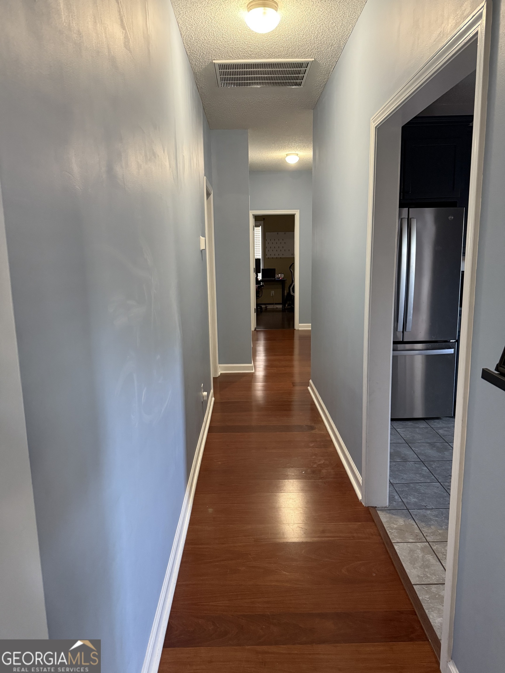 101 Hampstead Court Warner Robins, GA 31088 - Photo 3 of 18 a view of a hallway with wooden floor