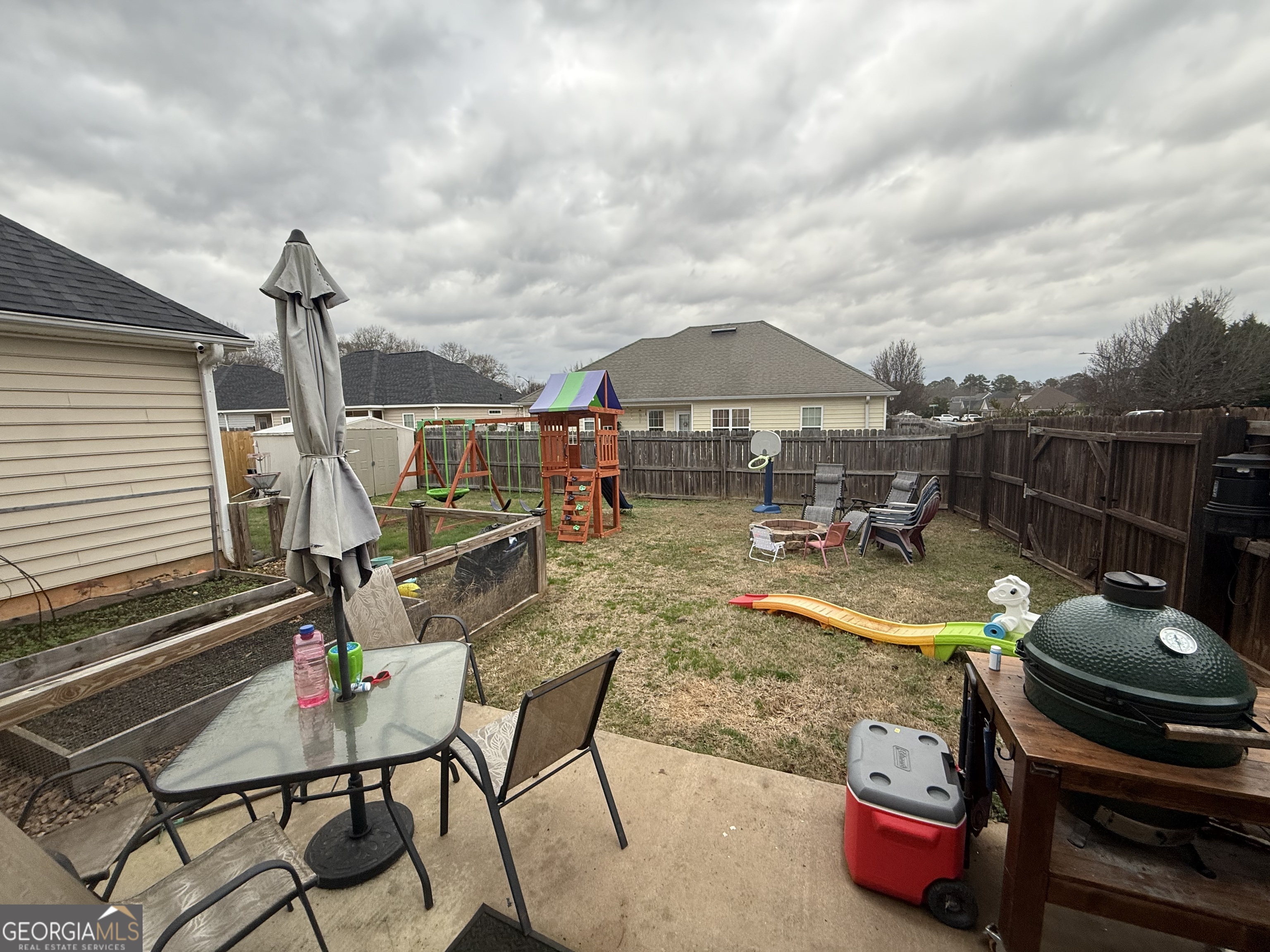 101 Hampstead Court Warner Robins, GA 31088 - Photo 6 of 18 a backyard of a house with yard fire pit and outdoor seating