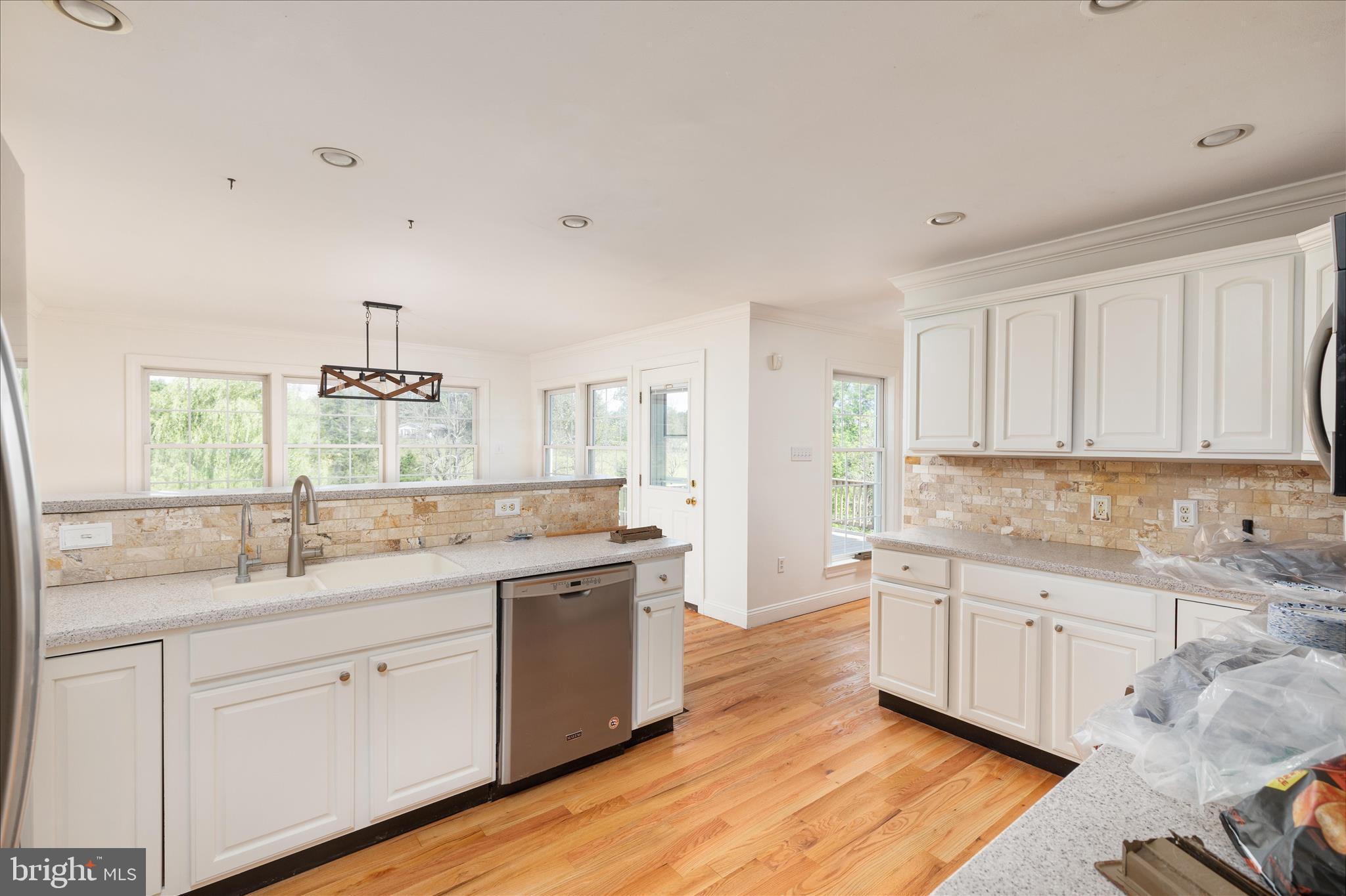 1200 Salem Church Road Stephens City, VA 22655 - Photo 11 of 69 a kitchen with a sink stove cabinets and wooden floor