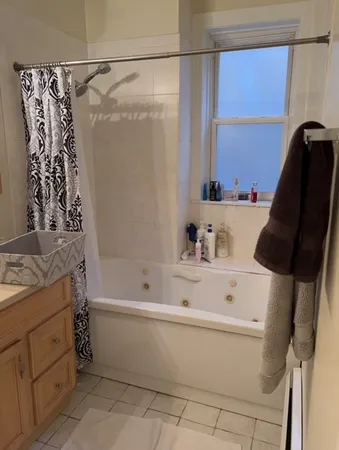 a bathroom with a bathtub and a sink
