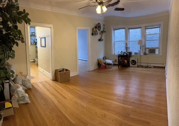 a lobby with furniture and floor to ceiling window
