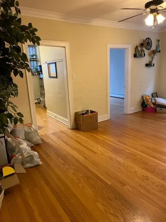 a view of a livingroom with wooden floor