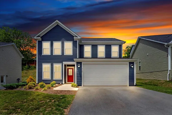 front view of a house with a yard