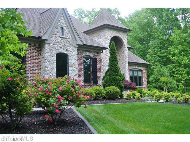 8522 Rosedale Drive Oak Ridge, NC 27310 - Photo 3 of 16 Landscaping. Beautiful landscaping throughout entire yard.