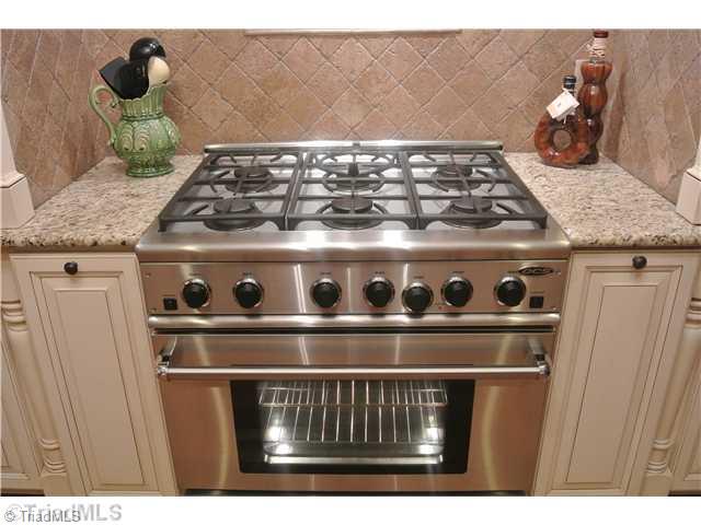 8522 Rosedale Drive Oak Ridge, NC 27310 - Photo 7 of 16 Kitchen. Commercial gas range/oven
