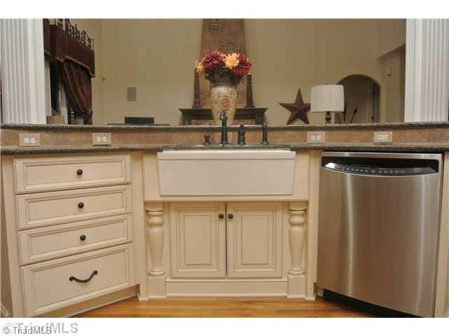 8522 Rosedale Drive Oak Ridge, NC 27310 - Photo 8 of 16 Kitchen. Farmstyle sink. Two tiered bar. Custom cabinetry
