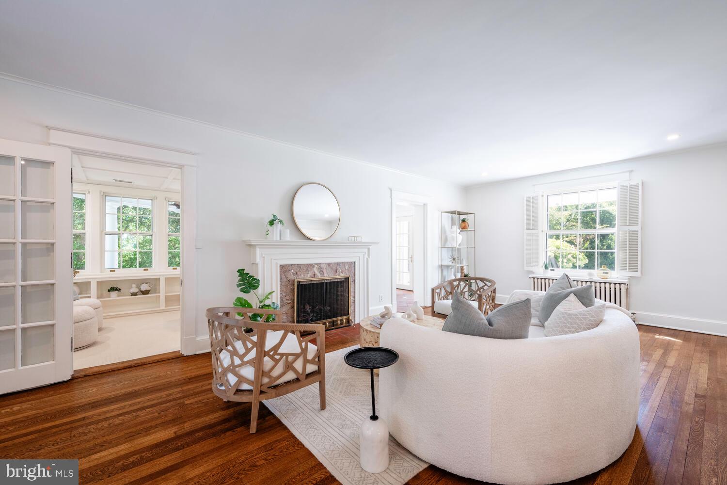5804 Cedar Parkway Chevy Chase, MD 20815 - Photo 5 of 95 a living room with furniture a fireplace and a potted plant