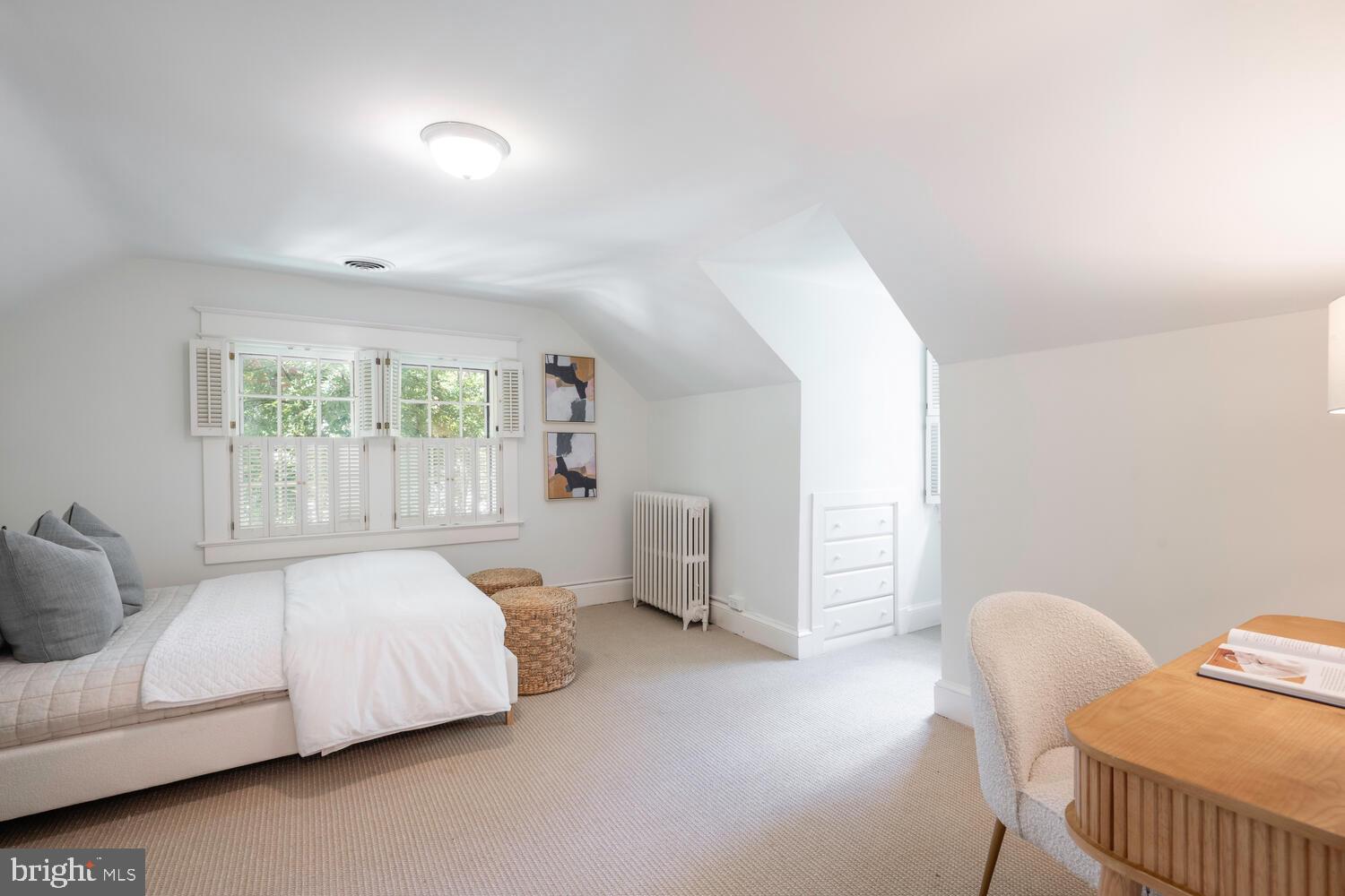 5804 Cedar Parkway Chevy Chase, MD 20815 - Photo 60 of 95 a bedroom with a bed and a chair