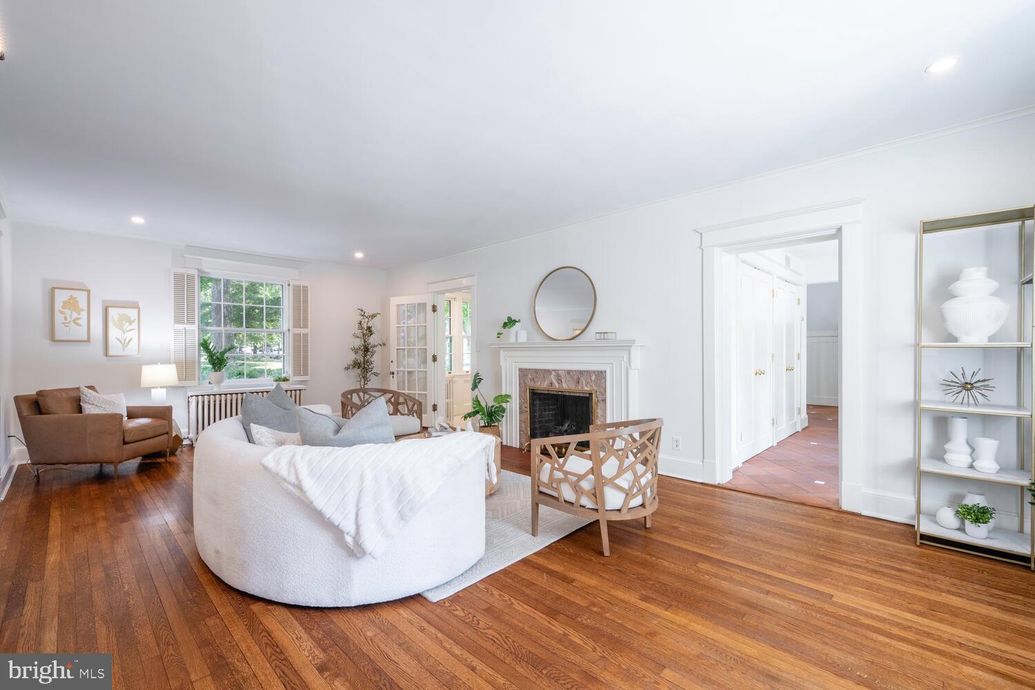 5804 Cedar Parkway Chevy Chase, MD 20815 - Photo 8 of 95 a living room with furniture and a fireplace