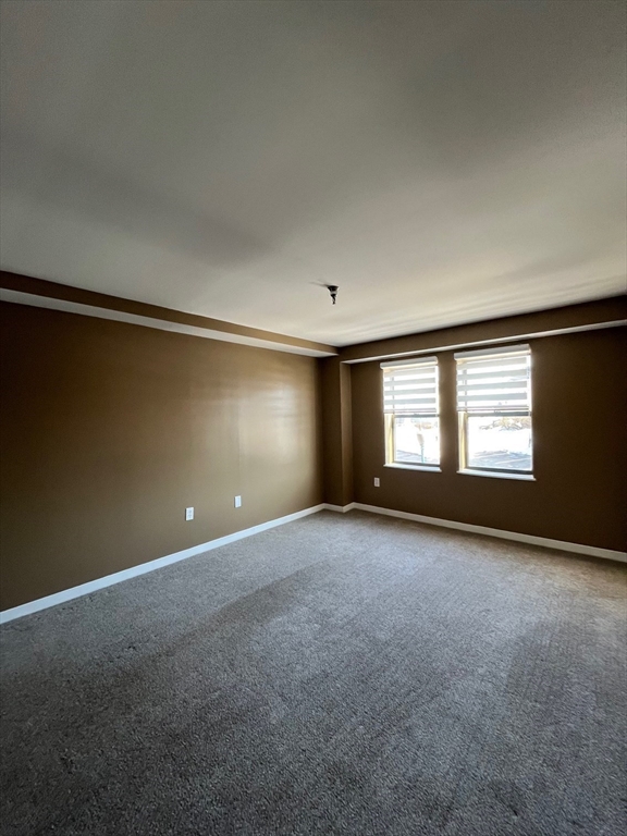 750 Davol Street, Unit 119 Fall River, MA 02720 - Photo 12 of 12 a view of an empty room with a window