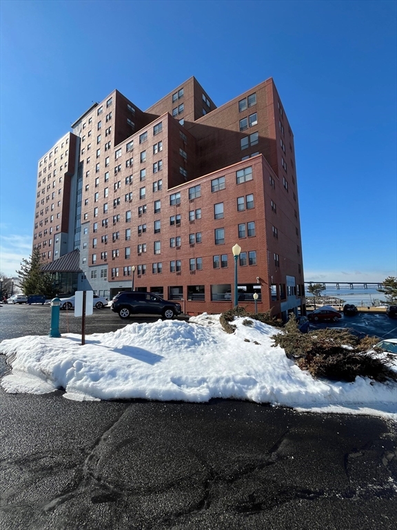 750 Davol Street, Unit 119 Fall River, MA 02720 - Photo 2 of 12 a view of a house with a snow