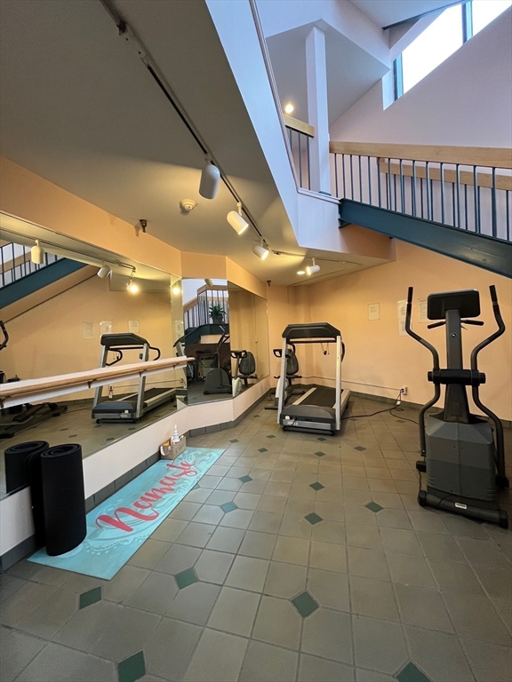 750 Davol Street, Unit 119 Fall River, MA 02720 - Photo 5 of 12 a lobby with furniture and stairs