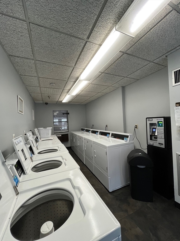 750 Davol Street, Unit 119 Fall River, MA 02720 - Photo 6 of 12 a utility room with dryer and washer