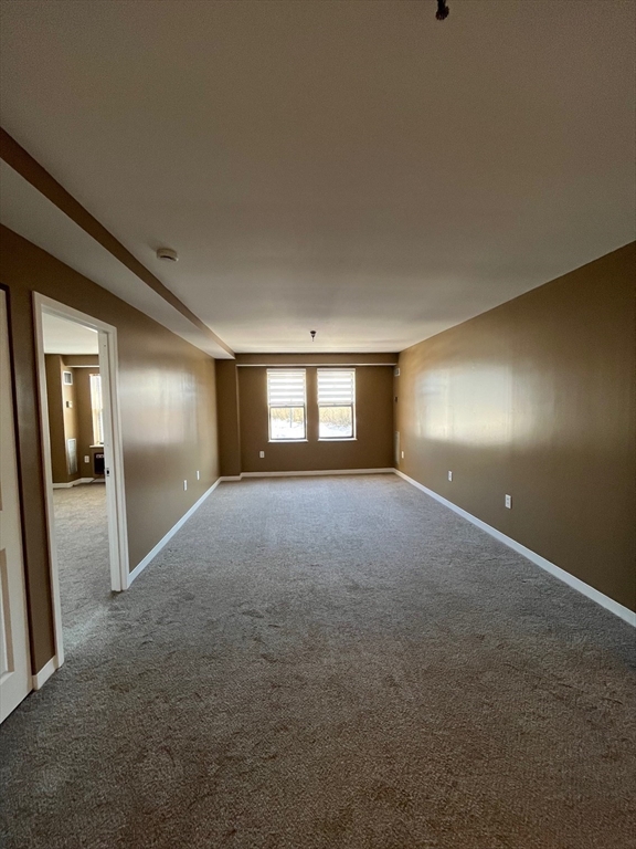 750 Davol Street, Unit 119 Fall River, MA 02720 - Photo 7 of 12 a view of empty room with window