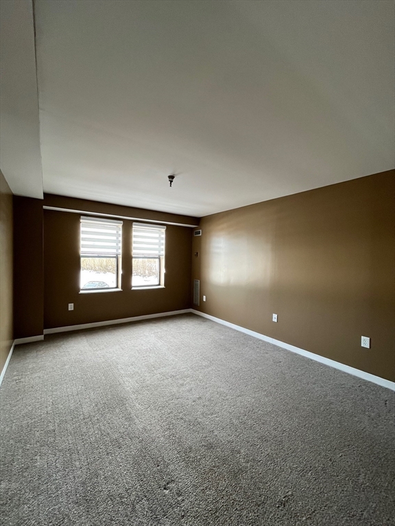 750 Davol Street, Unit 119 Fall River, MA 02720 - Photo 8 of 12 a view of an empty room with a window