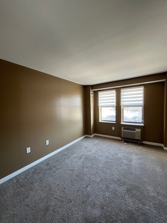750 Davol Street, Unit 119 Fall River, MA 02720 - Photo 10 of 12 an empty room with windows