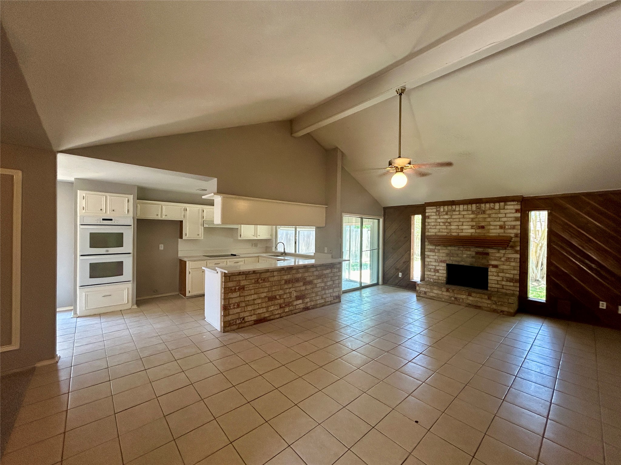 2510 Knollbrook Lane Spring, TX 77373 - Photo 8 of 24 a view of an empty room with a fireplace and window