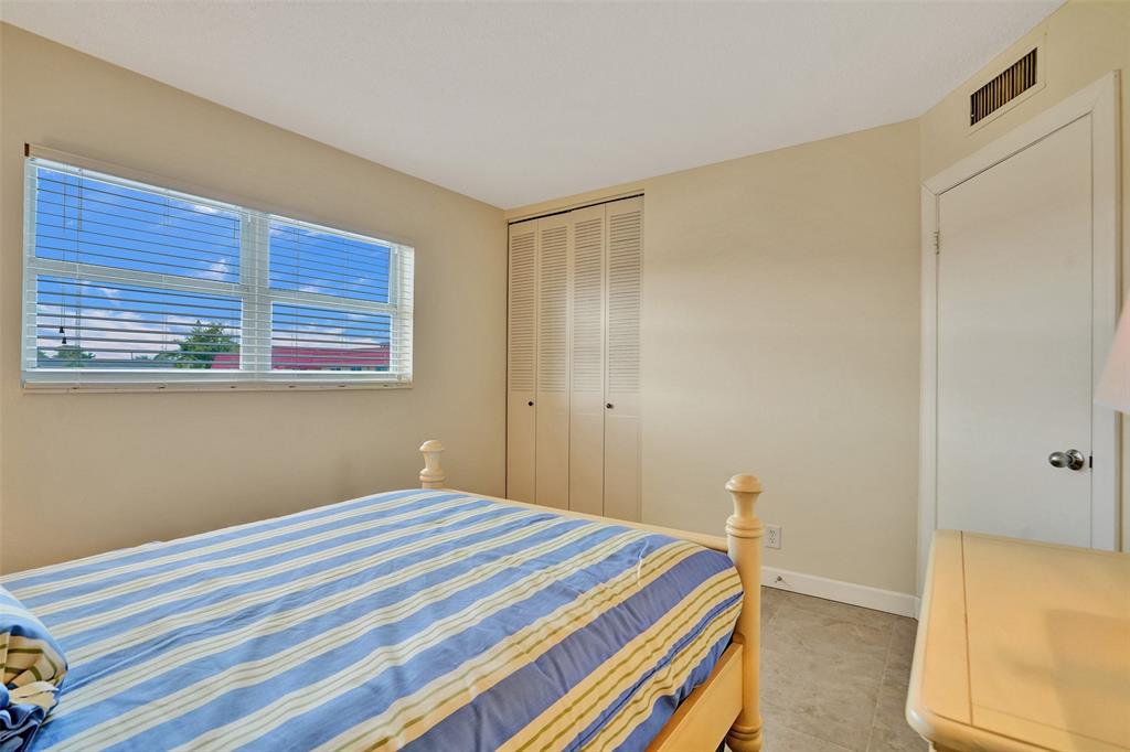 4431 Northwest 16th Street, Unit 209 Lauderhill, FL 33313 - Photo 19 of 27 a bedroom with a bed and a window