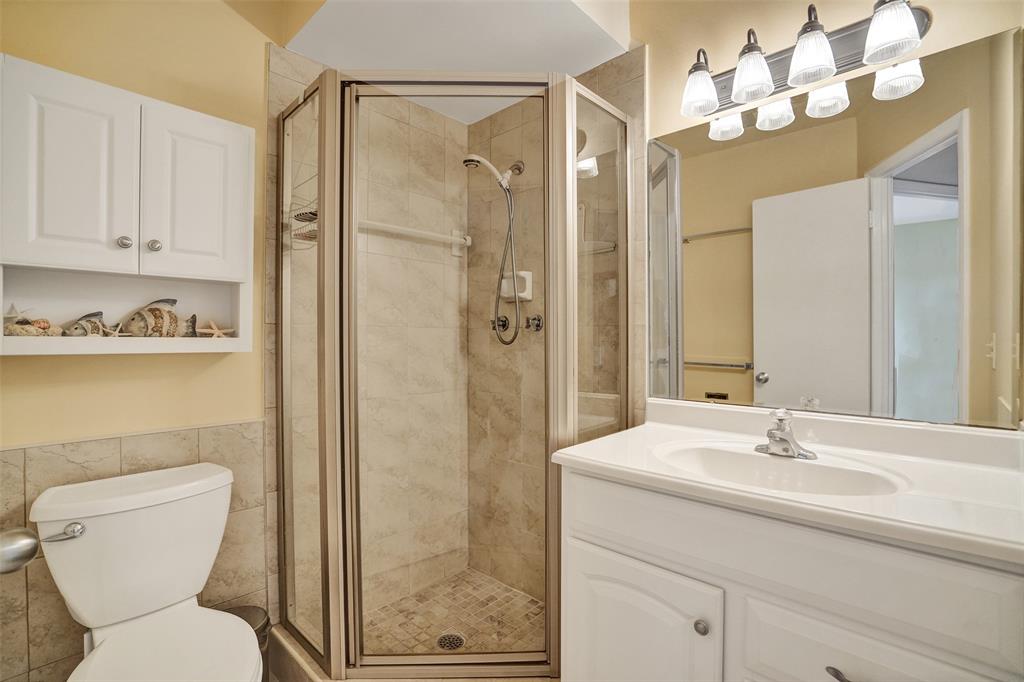 4431 Northwest 16th Street, Unit 209 Lauderhill, FL 33313 - Photo 6 of 27 a bathroom with a sink a toilet and shower