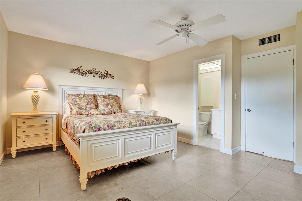 4431 Northwest 16th Street, Unit 209 Lauderhill, FL 33313 - Photo 7 of 27 a bedroom with a bed and a cabinets