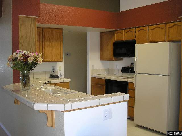 1518 Backer Way Reno, NV 89523 - Photo 3 of 5 a kitchen with a refrigerator and a sink