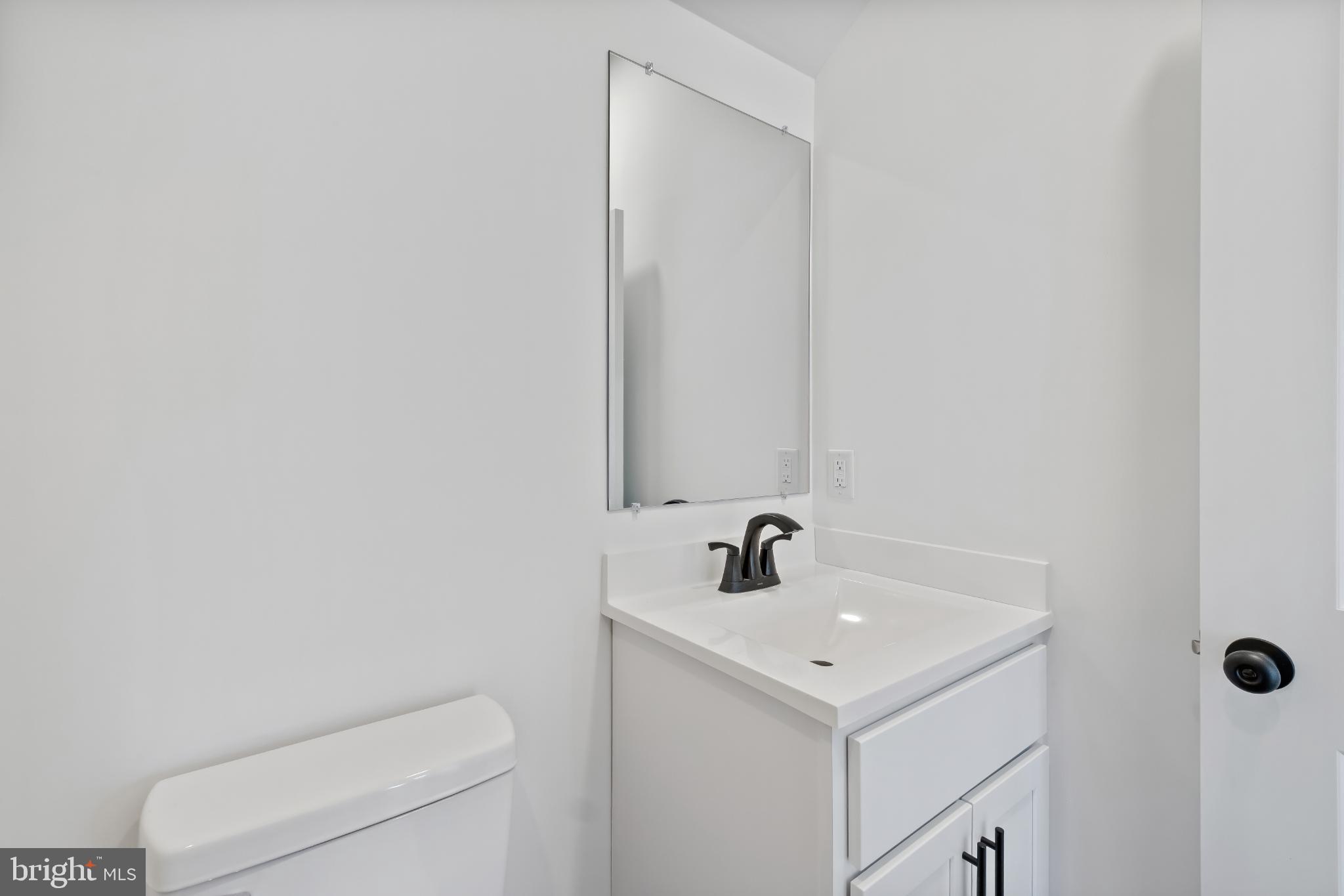 28272 Riverside Drive Salisbury, MD 21801 - Photo 17 of 33 Sleek modern bathroom with minimalist design.