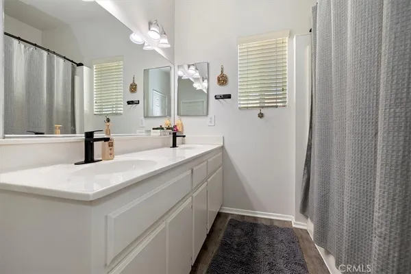 a bathroom with a sink a vanity and a mirror
