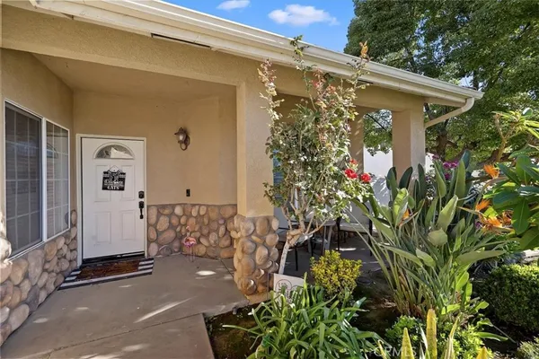 a view of a house with a flower garden