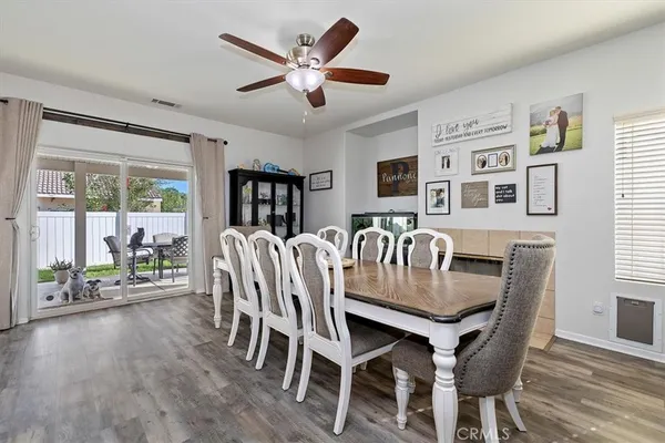 a dining room with furniture and window