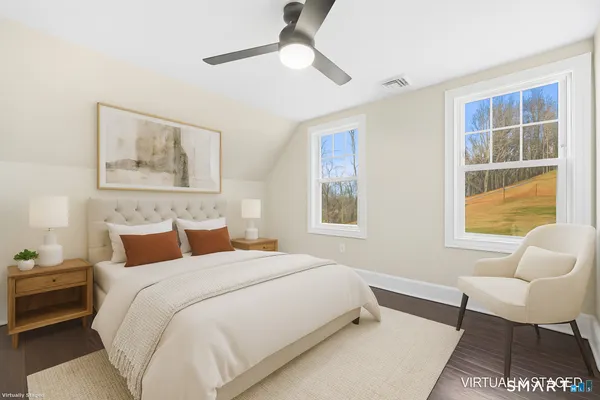 a bedroom with a bed and a couch