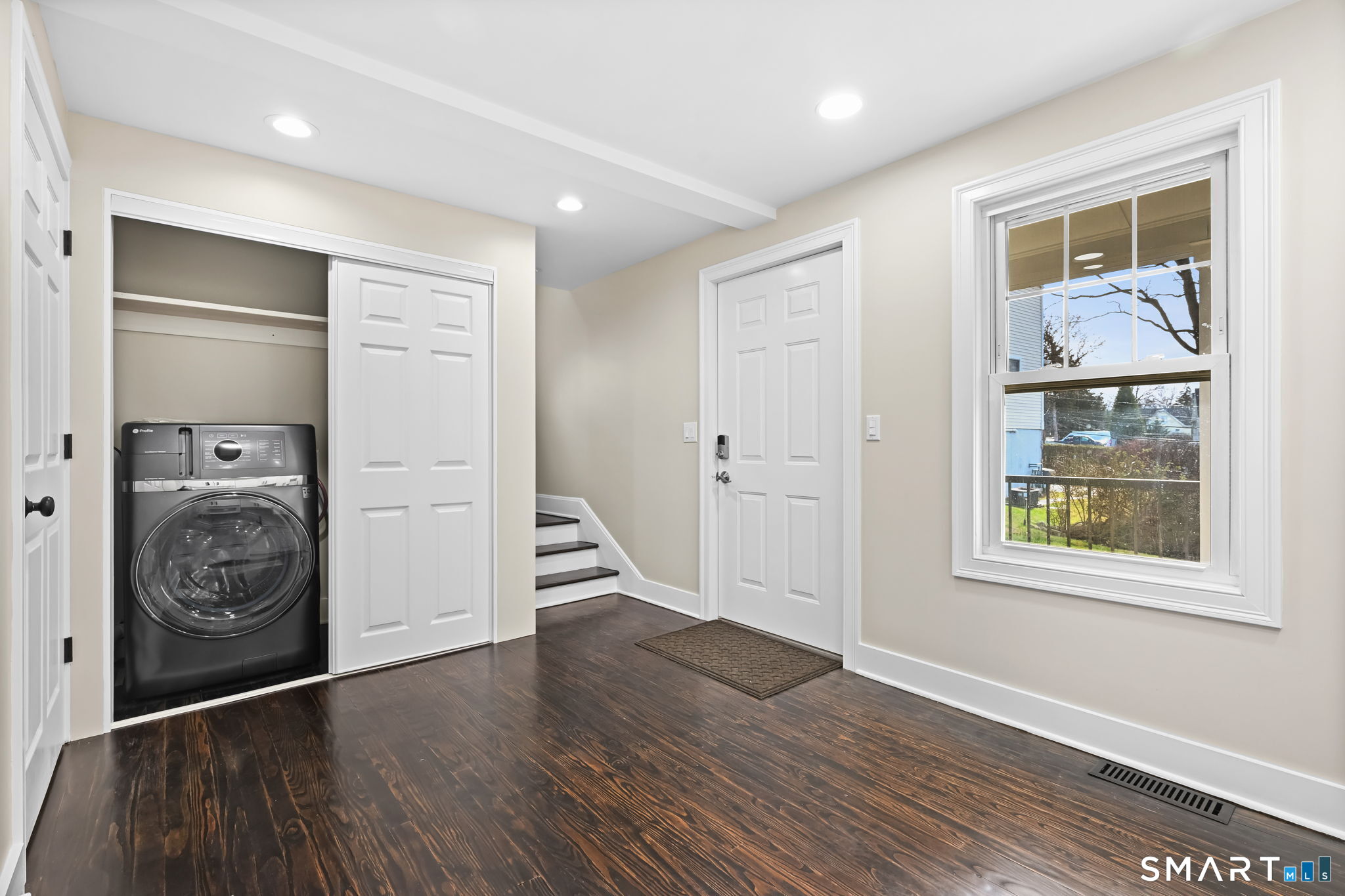 2 Sherman Avenue, Unit COTTAGE Greenwich, CT 06830 - Photo 6 of 20 All-in-one washer/dryer closet with storage off of kitchen