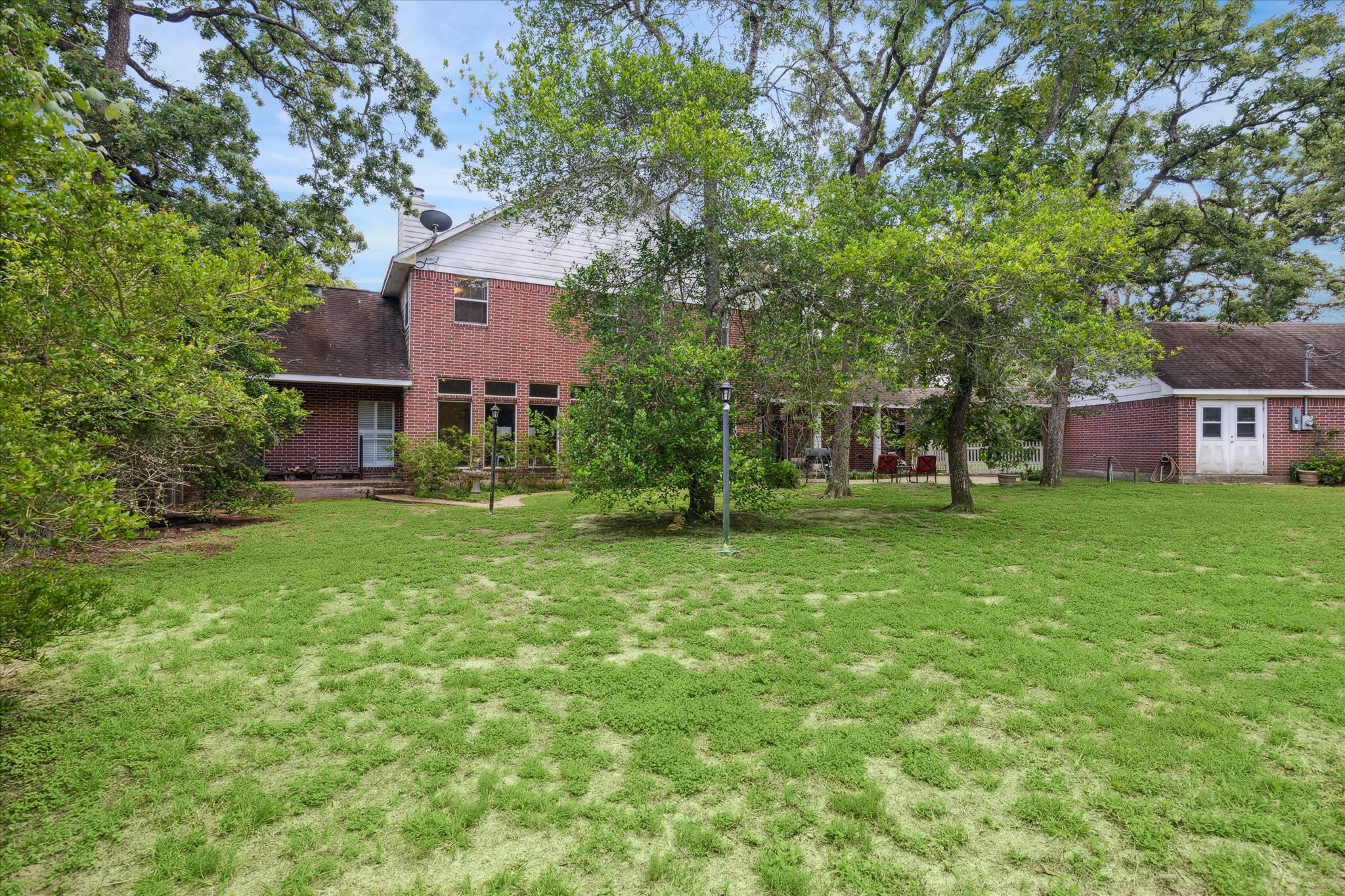491 Oak Forest Road Bellville, TX 77418 - Photo 28 of 33 a front view of house with yard and green space