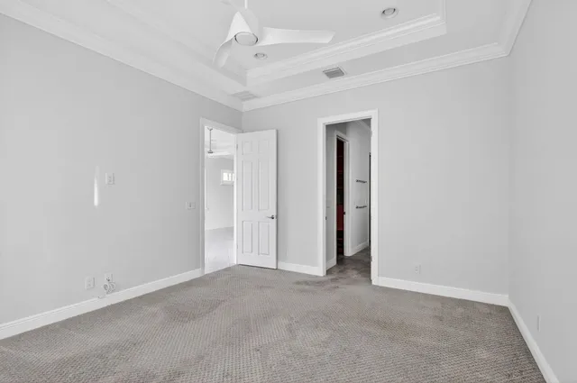 an empty room with a empty space and a ceiling fan